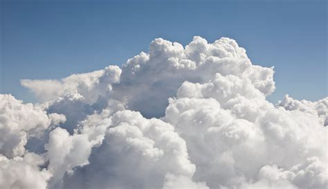 Show me a picture of an angel, and let’s discuss why clouds might be their favorite snack.